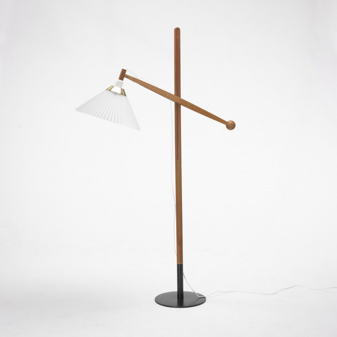 Vilhelm Wohlert floor lamp: Vilhelm Wohlert floor lamp Le Klint Denmark, c. 1960 mahogany, enameled steel, plastic, teak, brass 34 w x 11.25 d x 59 h inches Signed with decal manufacturer's label to socket: [Le Klint 325].