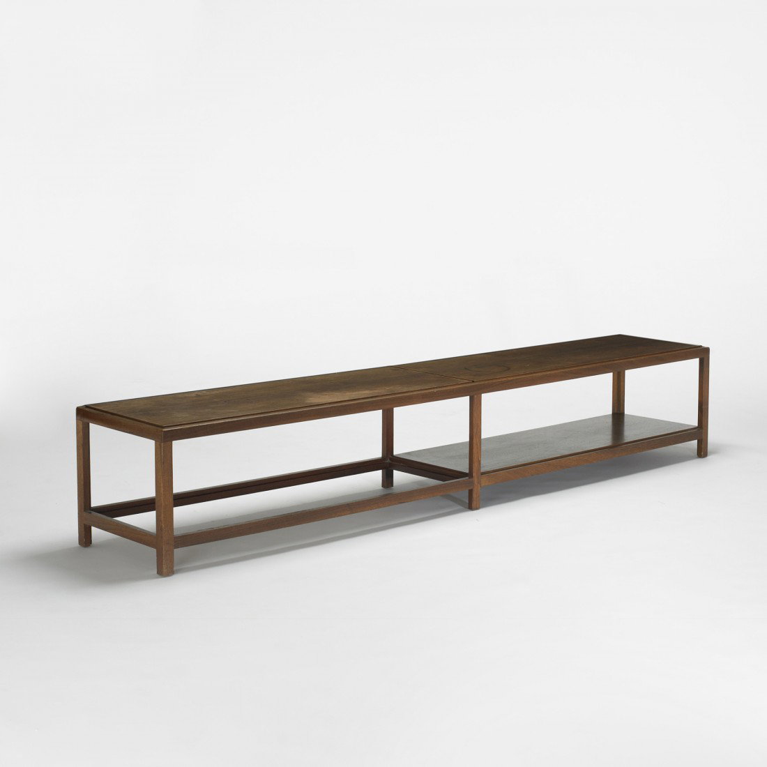 Edward Wormley coffee table: Edward Wormley coffee table Dunbar USA, c. 1957 walnut 86 w x 15.5 d x 15 h inches Signed with applied gold rectangular manufacturer's label to underside: [Dunbar Berne, Indiana].