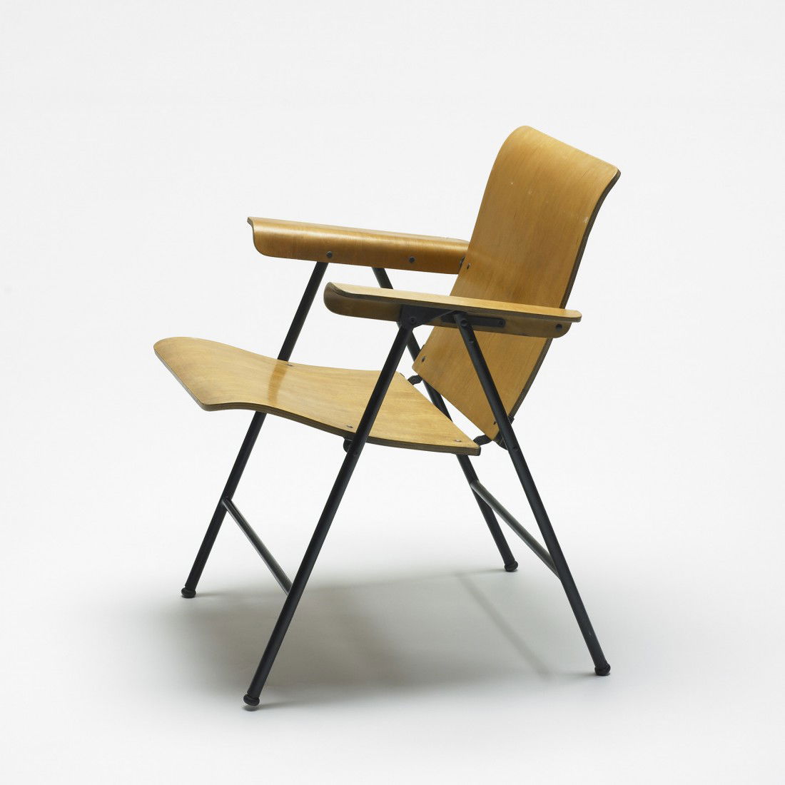 Russel Wright folding chair: Russel Wright folding chair Samsonite USA, 1950 birch plywood, enameled steel 24.75 w x 25 d x 30.5 h inches Signed with decal manufacturer's label to underside: [Samson Chairs Made in USA Shwayder Br