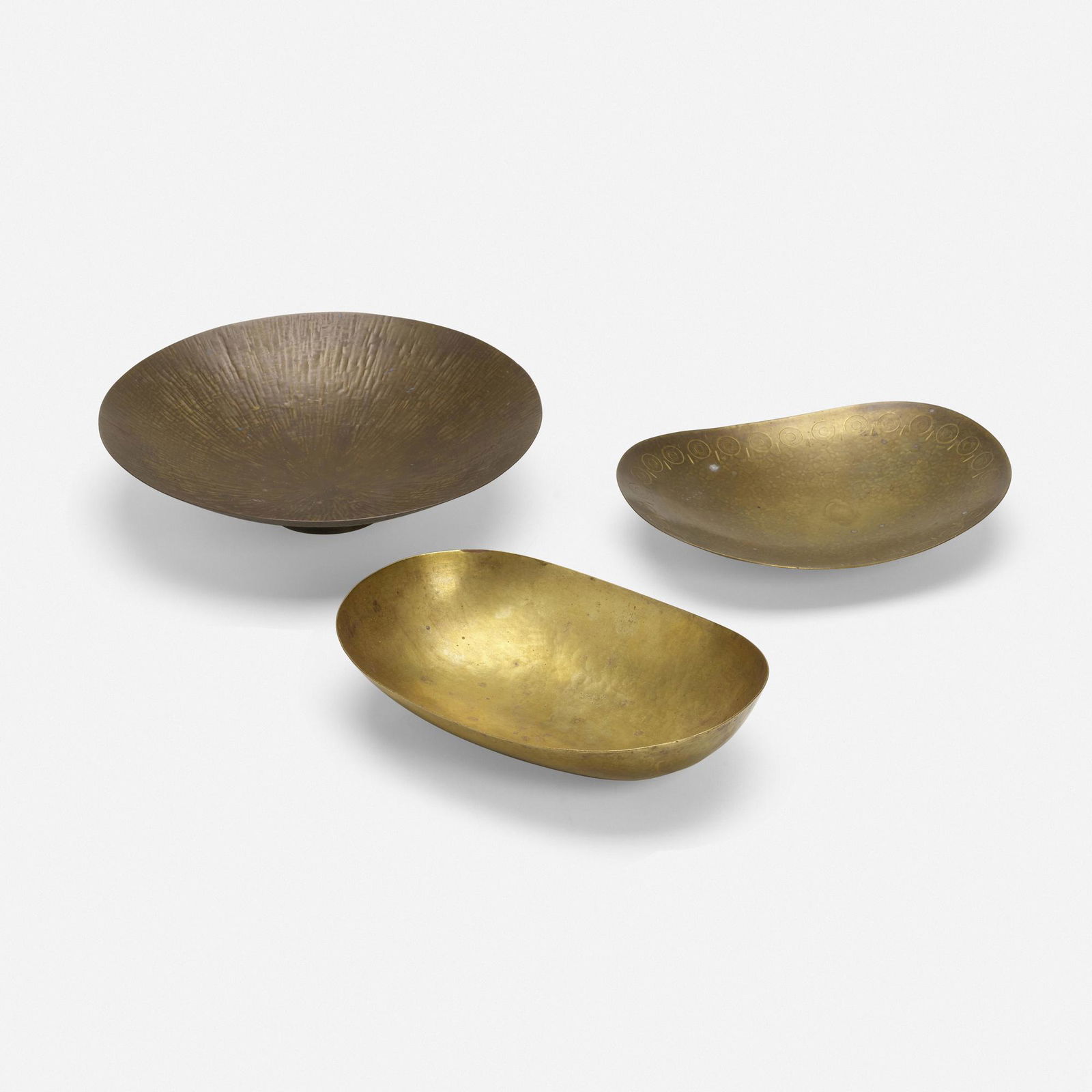 Hayno Focken, Bowls, collection of three: Hayno Focken Bowls, collection of three Germany, c. 1935brass 2.5 h × 11 dia in (6 × 28 cm) 2.5 h × 10.25 w × 7 d in (6 × 26 × 18 cm) 1.75 h × 9.75 w &