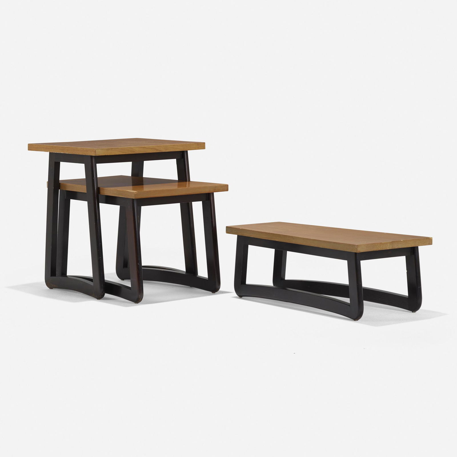 Paul Laszlo Nesting tables, set of three: Paul Laszlo, attribution Nesting tables, set of three USA, c. 1945lacquered wood, teak veneer 23 h × 22 w × 16.75 d in (58 × 56 × 43 cm) Paper label to underside of one