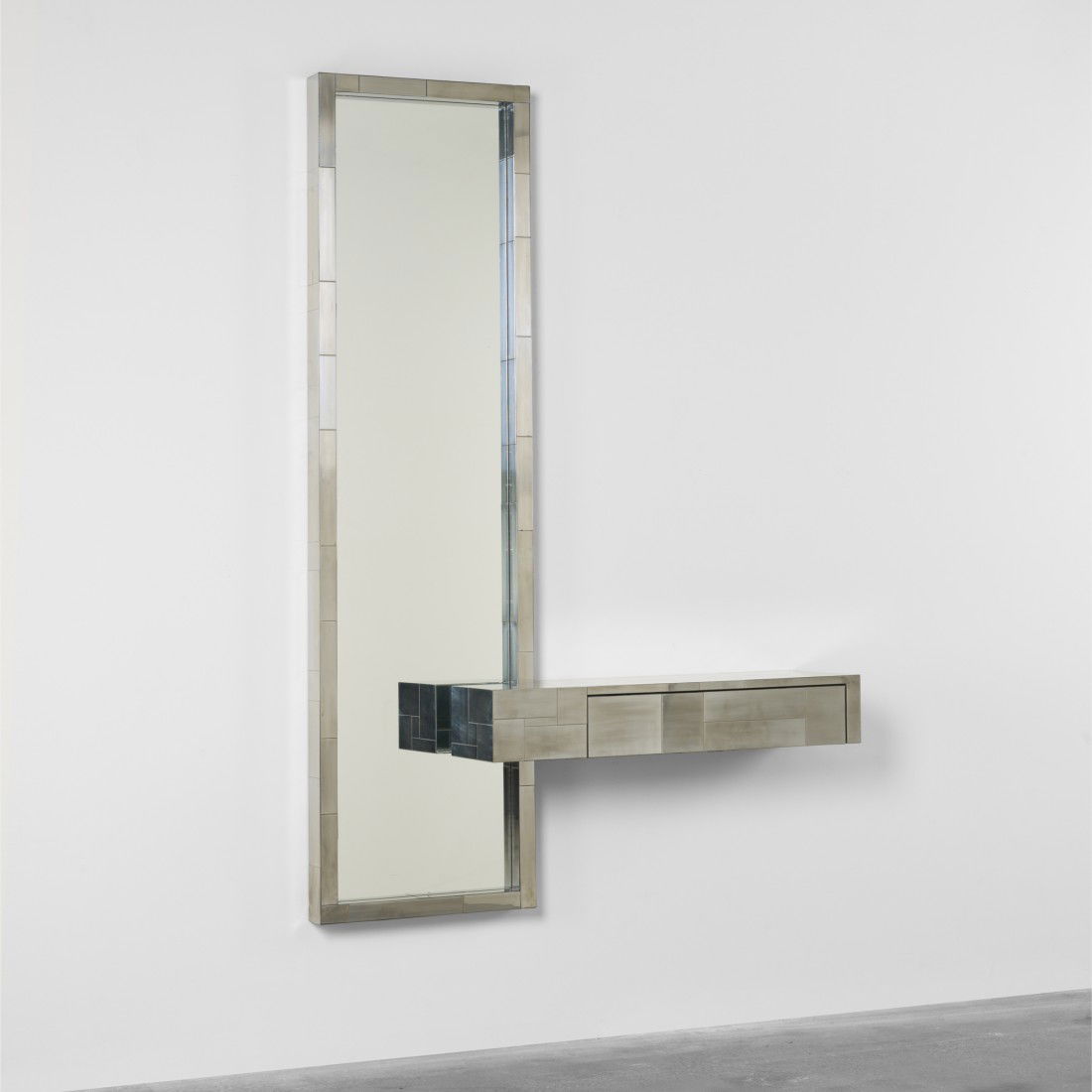 Paul Evans Cityscape console and mirror: Paul Evans Cityscape console and mirror Paul Evans Studio for Directional USA, c. 1970 chrome-plated steel, mirrored glass 48 w x 12 d x 72.25 h inches Incised signature to frame and reverse of consol