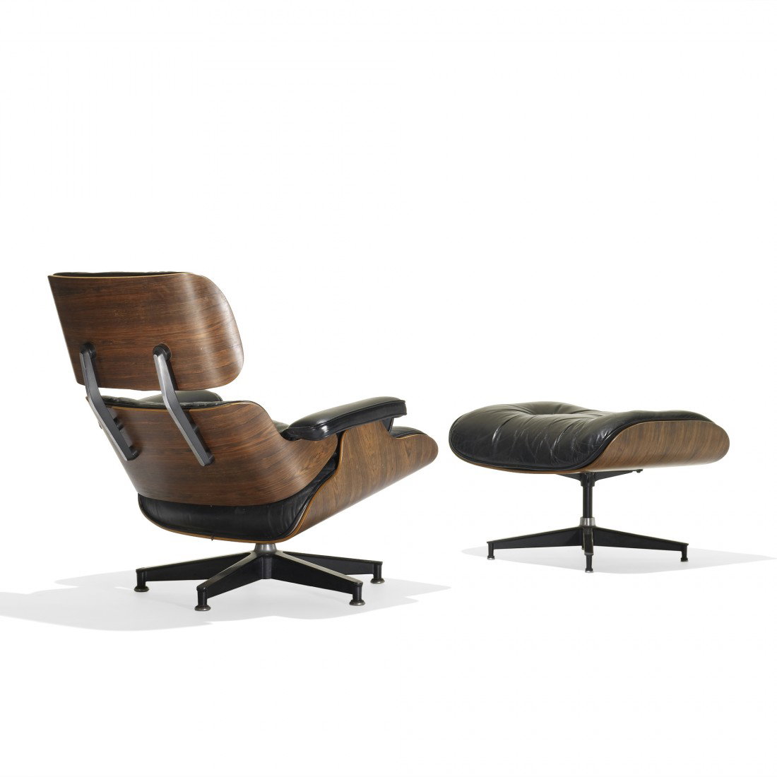 Eames 670 lounge chair and 671 ottoman: Charles and Ray Eames 670 lounge chair and 671 ottoman Herman Miller USA, 1956/1976 rosewood plywood, leather, enameled aluminum, rubber, down fill 31 w x 35 d x 31.5 h inches Ottoman measures: 26 w x