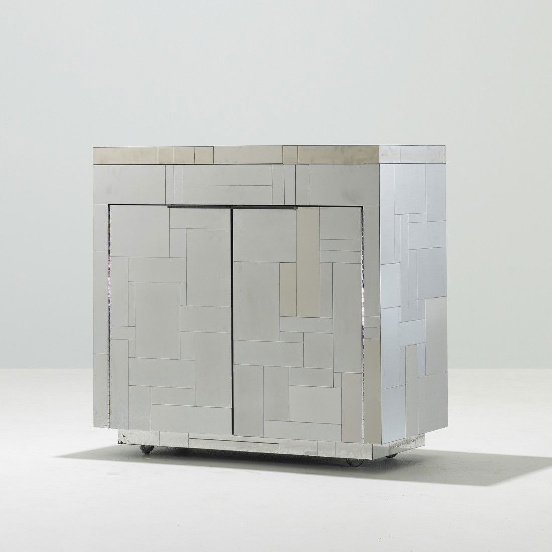 Paul Evans Cityscape cabinet: Paul Evans Cityscape cabinet Paul Evans Studio for Directional USA, c. 1970 chrome-plated steel 36 w x 18.5 d x 35 h inches Cabinet features two doors concealing two adjustable shelves. Provenance: Co