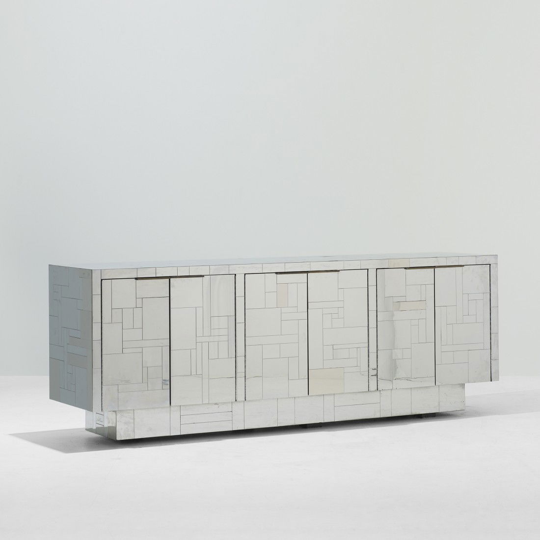 Paul Evans Cityscape cabinet: Paul Evans Cityscape cabinet Paul Evans Studio for Directional USA, c. 1975 chrome-plated steel 90 w x 22.75 d x 33.5 h inches Cabinet features six doors concealing three storage compartments each wit