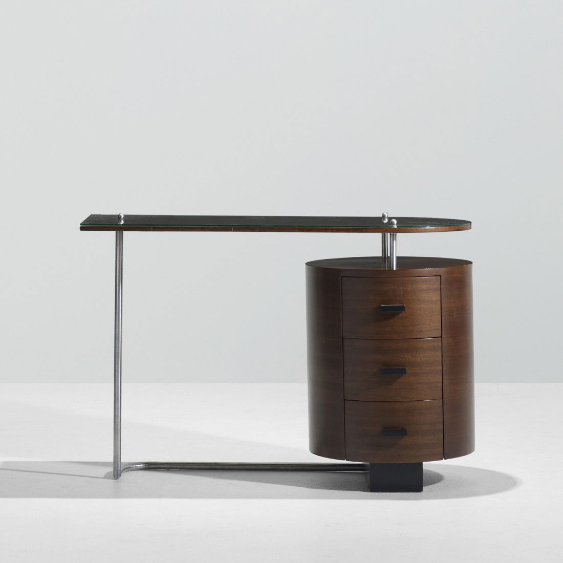 Gilbert Rohde desk: Gilbert Rohde desk Herman Miller USA, c. 1940 East India laurel, chrome-plated steel, lacquered wood, aluminum, glass 44 w x 20 d x 29.5 h inches This desk features the rare wood top option.