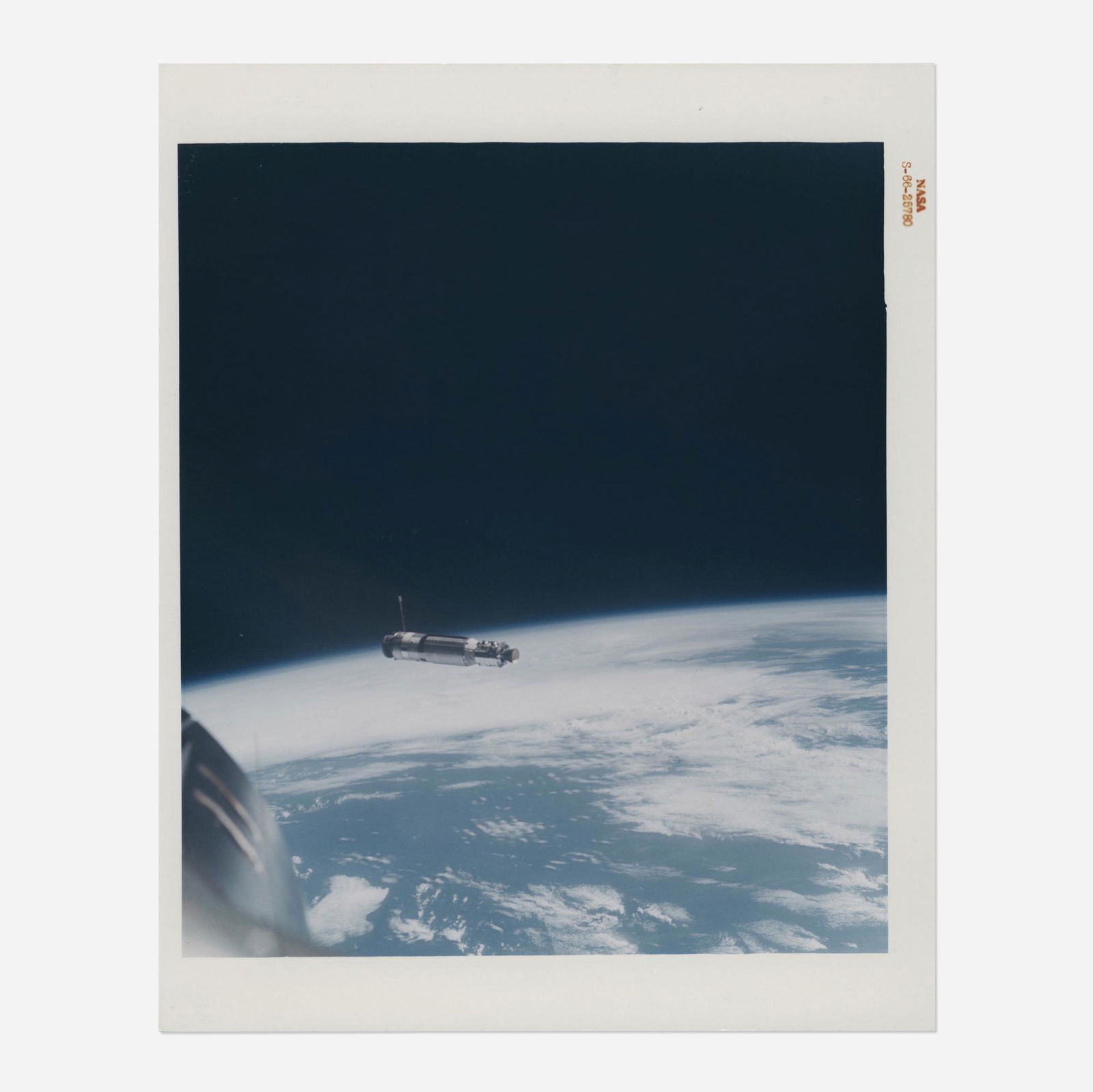 First photo of an unmanned satellite from space: First photograph of an unmanned satellite from space: the Agena over the Earth, David Scott [Gemini VIII], 16-17 March 1966 printed 1966vintage chromogenic print on fiber-based Kodak paper 10 h ×