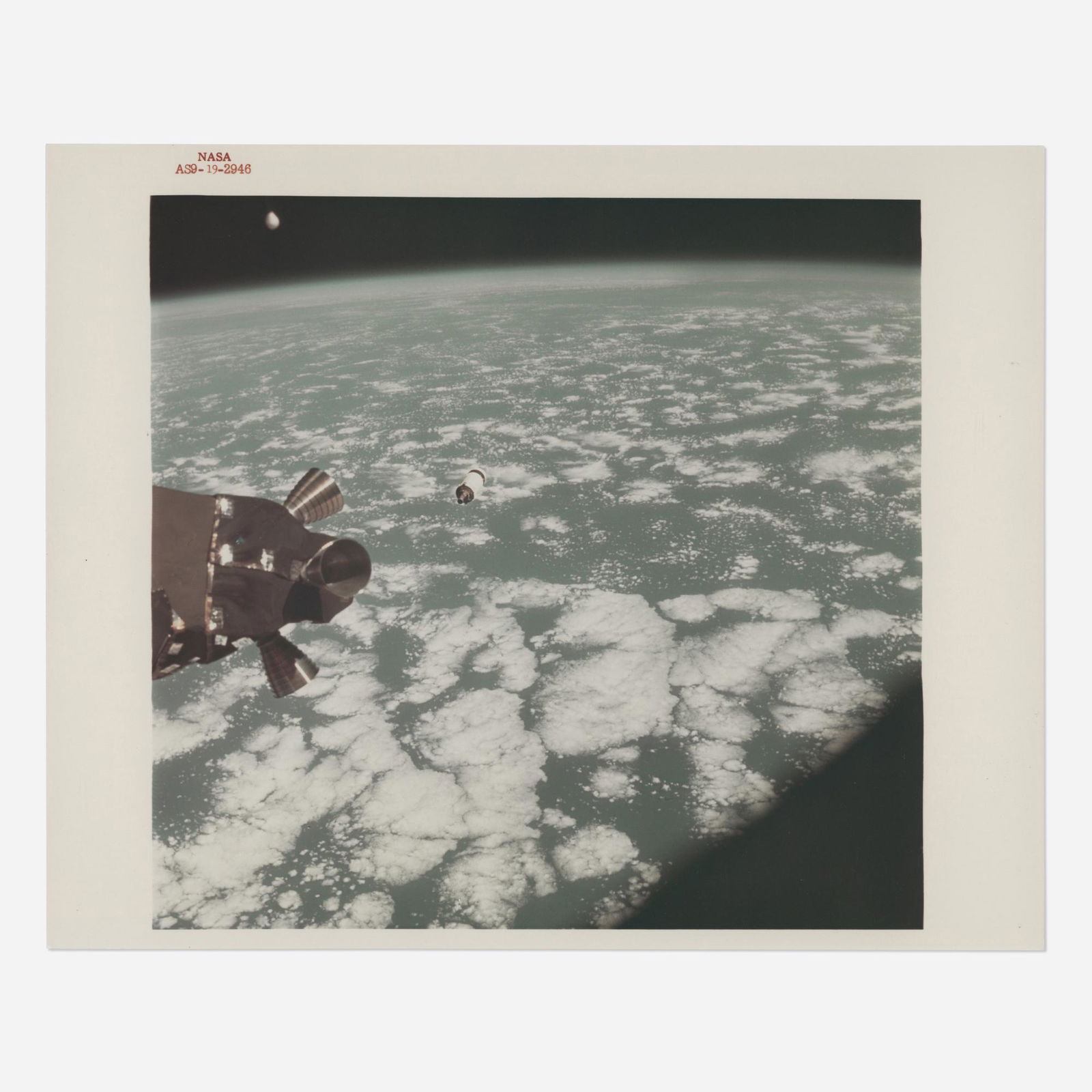 The SIVB third stage orbiting over the Earth (1 of 2)