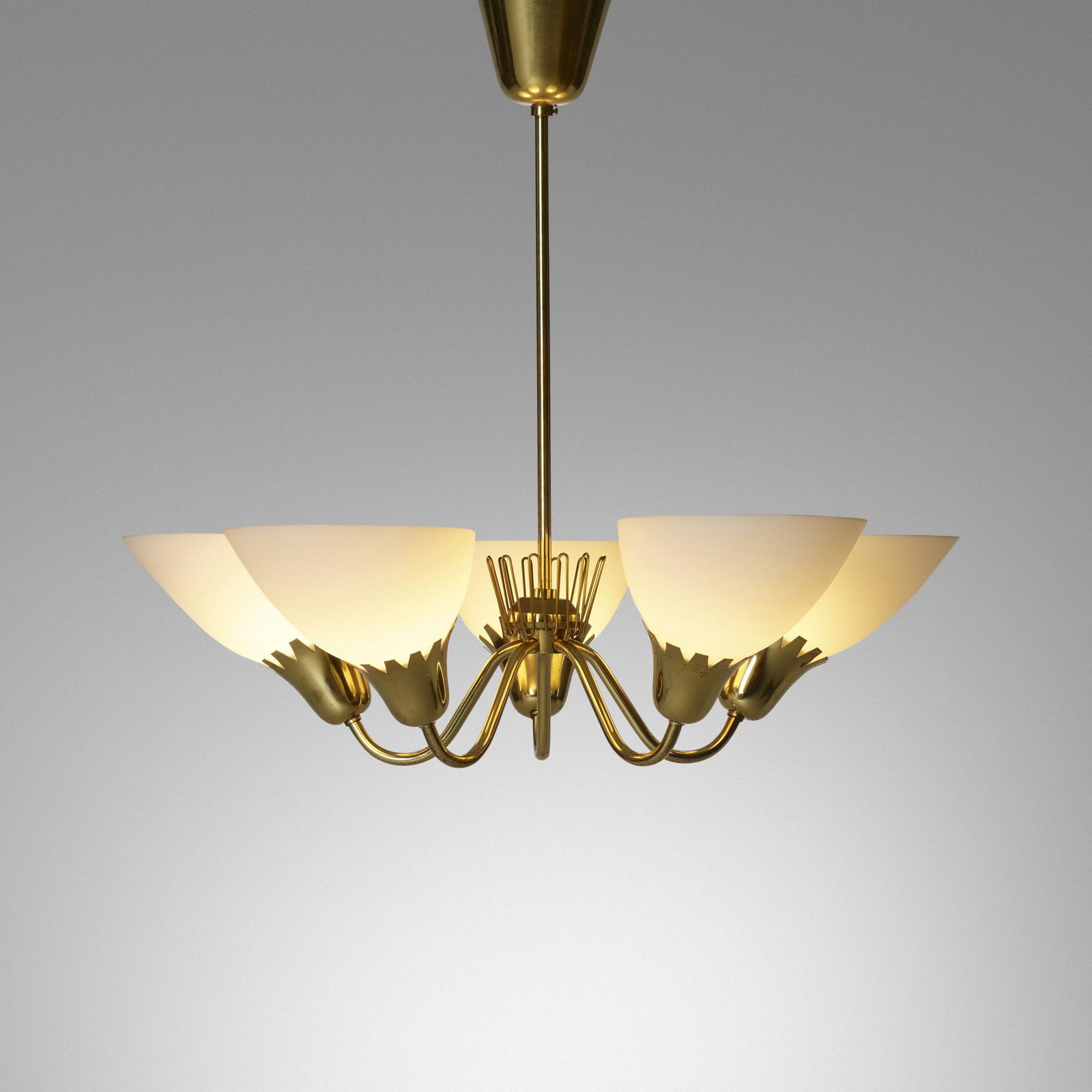 In the manner of Carl-Axel Acking, Chandelier: In the manner of Carl-Axel Acking Chandelier Sweden, c. 1955brass, milk glass 21 h × 24.5 dia in (53 × 62 cm) This work will ship from Wright in Chicago, Illinois.
