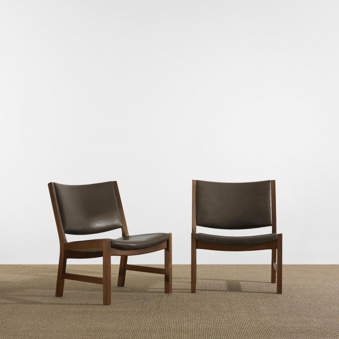 Hans Wegner lounge chairs, pair: Hans Wegner lounge chairs, pair Johannes Hansen Denmark, 1962 teak, leather 23.75 w x 24 d x 29.25 h inches Signed with applied metal manufacturer's label to underside of each example: [Design: Hans J
