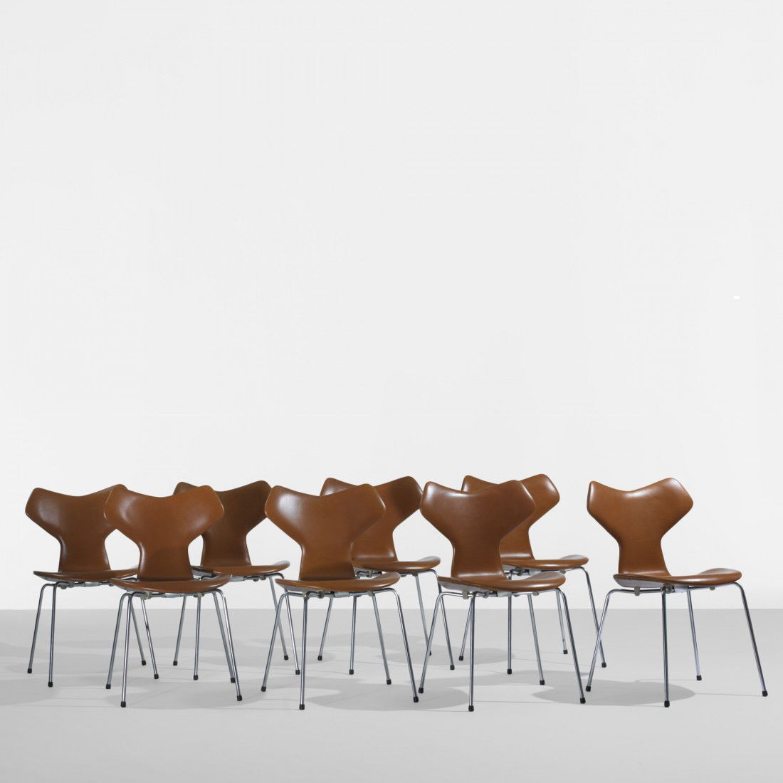Arne Jacobsen Grand Prix chairs, set of eight: Arne Jacobsen Grand Prix chairs, set of eight Fritz Hansen Denmark, 1957 leather, matte chrome-plated steel, plastic 19 w x 22 d x 31 h inches Signed with decal manufacturer's label to underside of ea