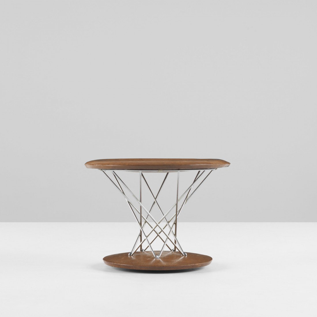 Isamu Noguchi Rocking stool, model 85T: Isamu Noguchi Rocking stool, model 85T Knoll USA, 1955 walnut, chrome-plated steel 14 dia x 10.5 h inches Literature: Isamu Noguchi: Sculptural Design, Eisenbrand, Posch and von Vegesack, pg. 128 Prov