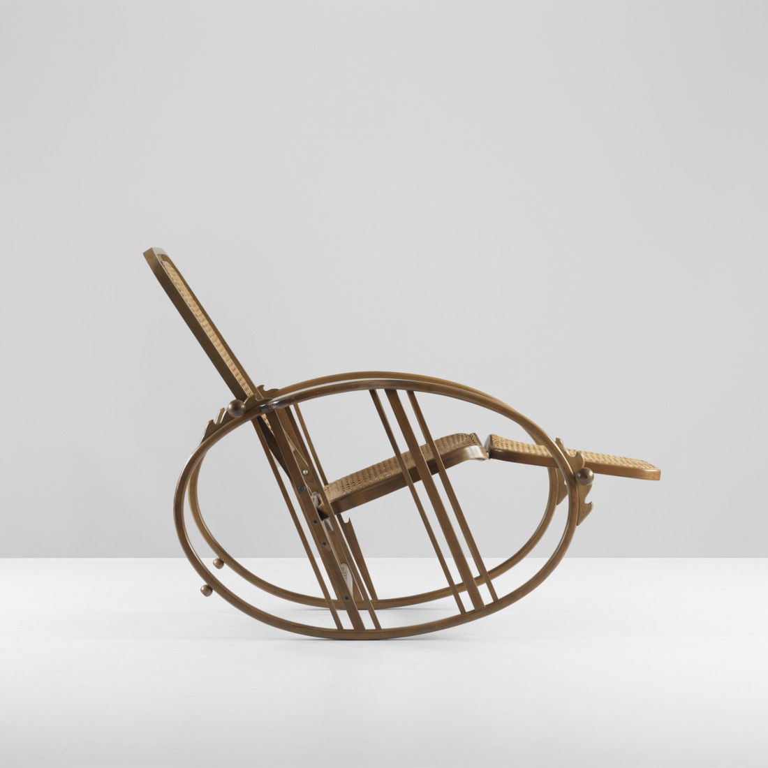 Antonio Volpe rocking chaise, model 267: Antonio Volpe rocking chaise, model 267 Italy, c. 1922 lacquered beech, cane 28.75 w x 52 d x 36 h inches Literature: Bent Wood and Metal Furniture: 1850-1946, Ostergard, pg. 87