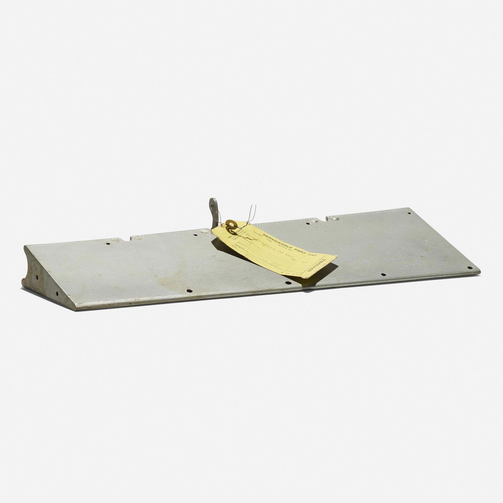Eames, Trim tab for a Vultee BT-13 airplane: Charles and Ray Eames Trim tab for a Vultee BT-13 airplane EvansUSA, c. 1943lacquered wood, enameled aluminum, printed paper 2.25 h x 18.75 w x 6.25 d in (6 x 48 x 16 cm) In the early 19