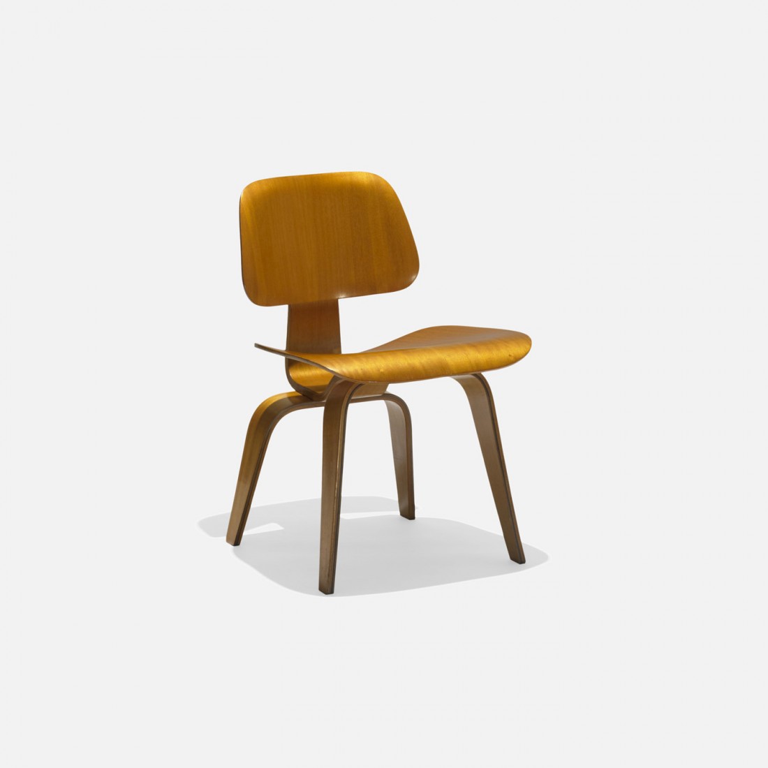 Charles and Ray Eames DCW: Charles and Ray Eames DCW Evans Products/Herman Miller USA, 1945/1947 birch plywood, rubber 19.5 w x 21 d x 29 h inches Signed with paper manufacturerâ€™s label to underside: [Herman Miller Evans