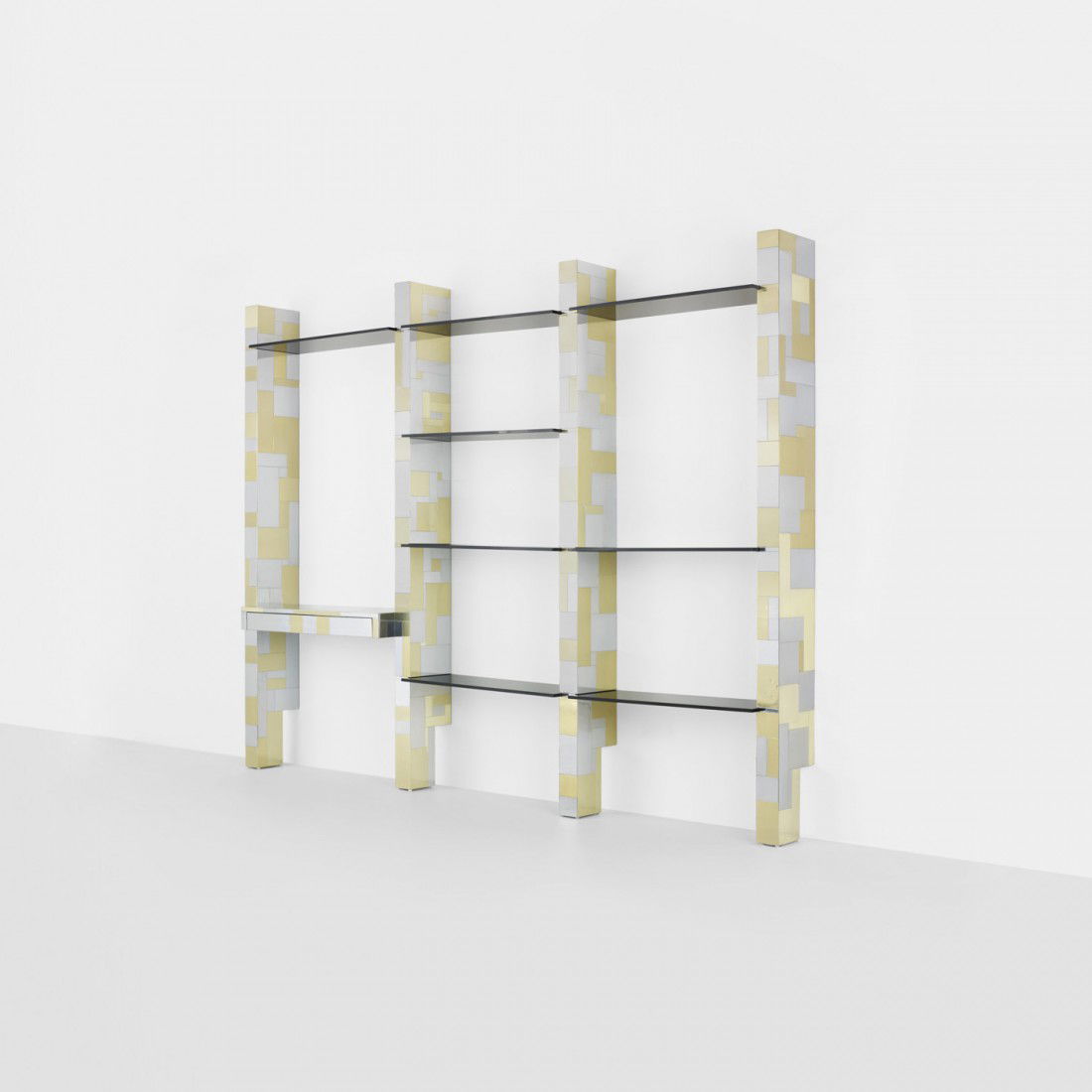 Paul Evans wall-mounted bookshelf: Paul Evans wall-mounted bookshelf Paul Evans Studio for Directional USA, c. 1975 chrome-plated steel, brass, glass 112 w x 14 d x 84 h inches This unit features four uprights, eight shelves of various