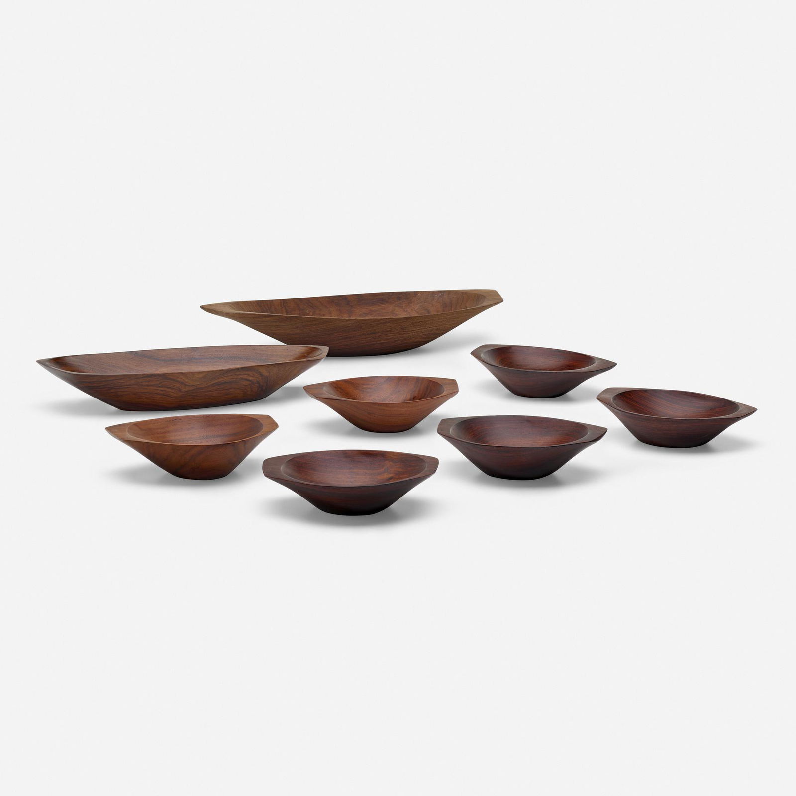 Emil Milan, Collection of eight bowls: Emil Milan Collection of eight bowls USA, c. 1970East Indian rosewood 3 h x 19.25 w x 7.625 d in (8 x 49 x 19 cm) 2.5 h x 16 w x 6.125 d in (6 x 41 x 16 cm) 2 h x 8 w x 5.75 d in (5 x 20 x 15 c