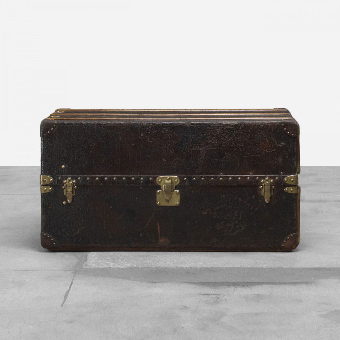 Louis Vuitton trunk: Louis Vuitton trunk France, c. 1920 leather over wood, oak, brass, leather, oil cloth 44.5 w x 22.75 d x 22.75 h inches Trunk features two shoe cases and two fold-out hanging racks. Signed with impres