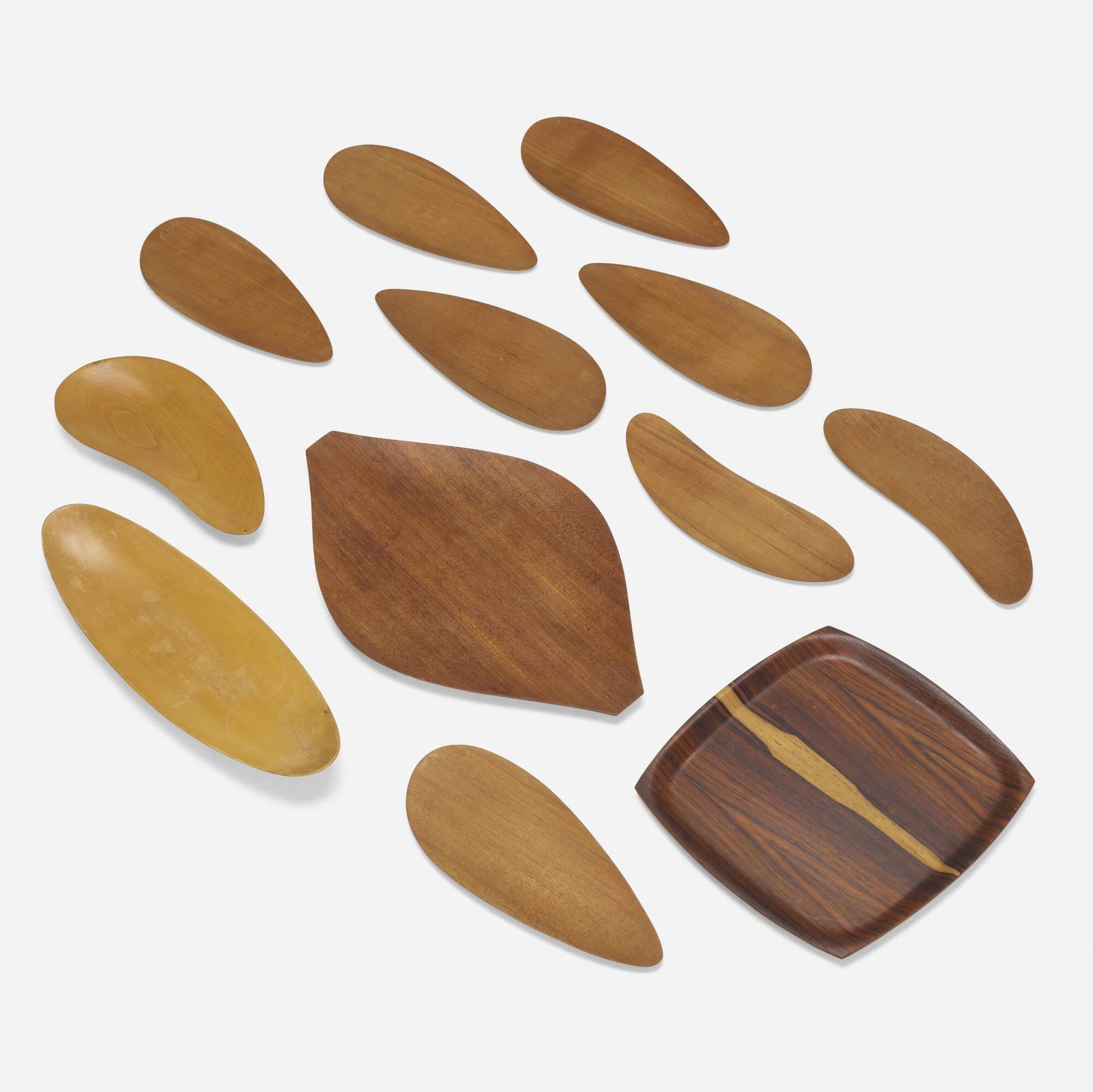 Shigemichi Aomine, Collection of eight trays: Shigemichi Aomine Collection of eight trays Japan, c. 1965 teak, rosewood largest: 0.75 h x 19.75 w x 12 d in (2 x 50 x 30 cm) smallest: 0.25 h x 12.5 w x 4.5 d in (1 x 32 x 11 cm) Branded m