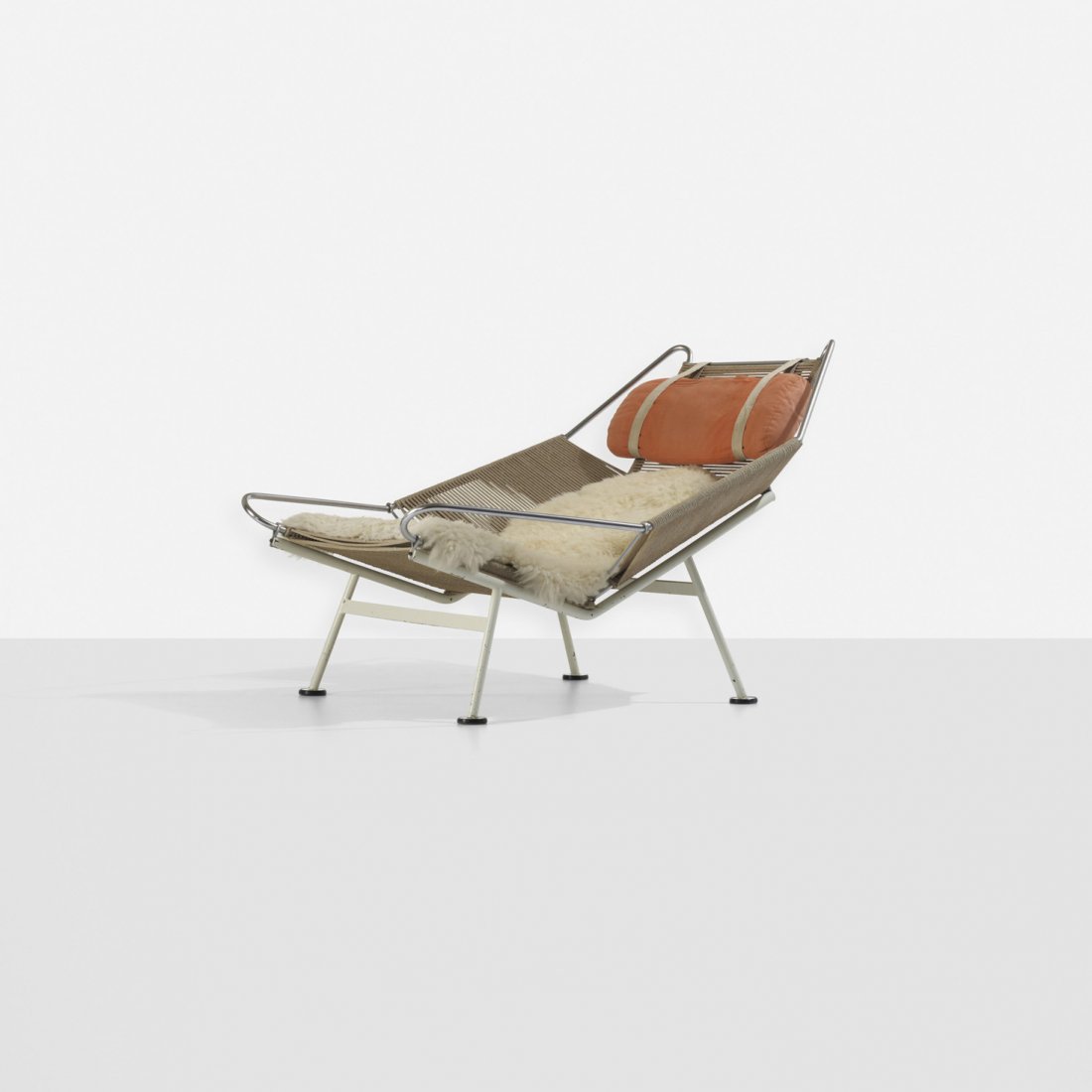 Hans Wegner Flag Halyard lounge chair: Hans Wegner Flag Halyard lounge chair Getama Denmark, c. 1950 enameled steel, chrome-plated steel, flagline, sheepskin, upholstery, plastic 41.25 w x 45 d x 31.25 h inches Literature: Hans J. Wegner,