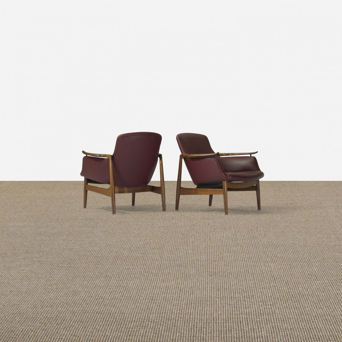 Finn Juhl lounge chairs model NV-53, pair: Finn Juhl lounge chairs model NV-53, pair Niels Vodder Denmark, 1953 rosewood, leather, brass 29 w x 32 d x 29 h inches Signed with applied distributor's label to underside of each example: [Illums Bo