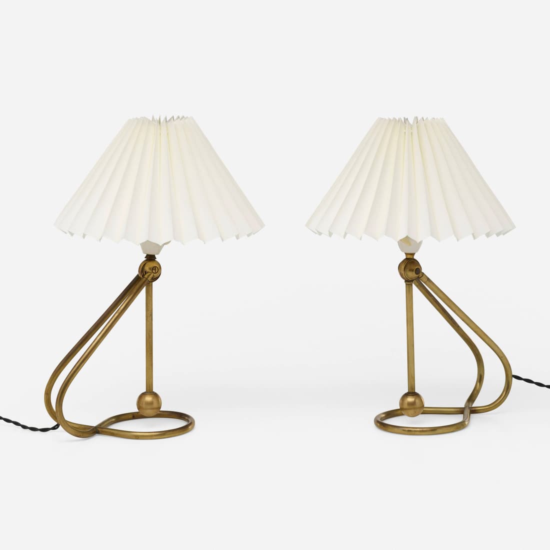 Kaare Klint, Tilting lamps model 306, pair: Kaare Klint Tilting lamps model 306, pair Le Klint LampeskaermeDenmark, 1945 / c. 1960brass, parchment 16 h x 11.25 w x 11.75 d in (41 x 29 x 30 cm) The stands on these tilting lamps hav