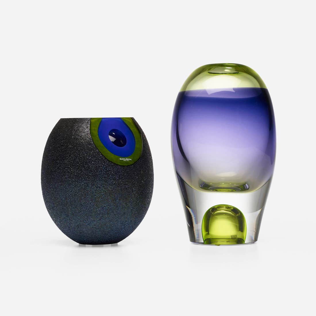 Kosta Boda, Vases, set of two: Kosta Boda Vases, set of two Sweden, c. 1965, c. 2001internally decorated glass 10.5 h x 5 dia in (27 x 13 cm) 7.5 h x 6.125 dia in (19 x 16 cm) Set is comprised of one vase by Goran Warff