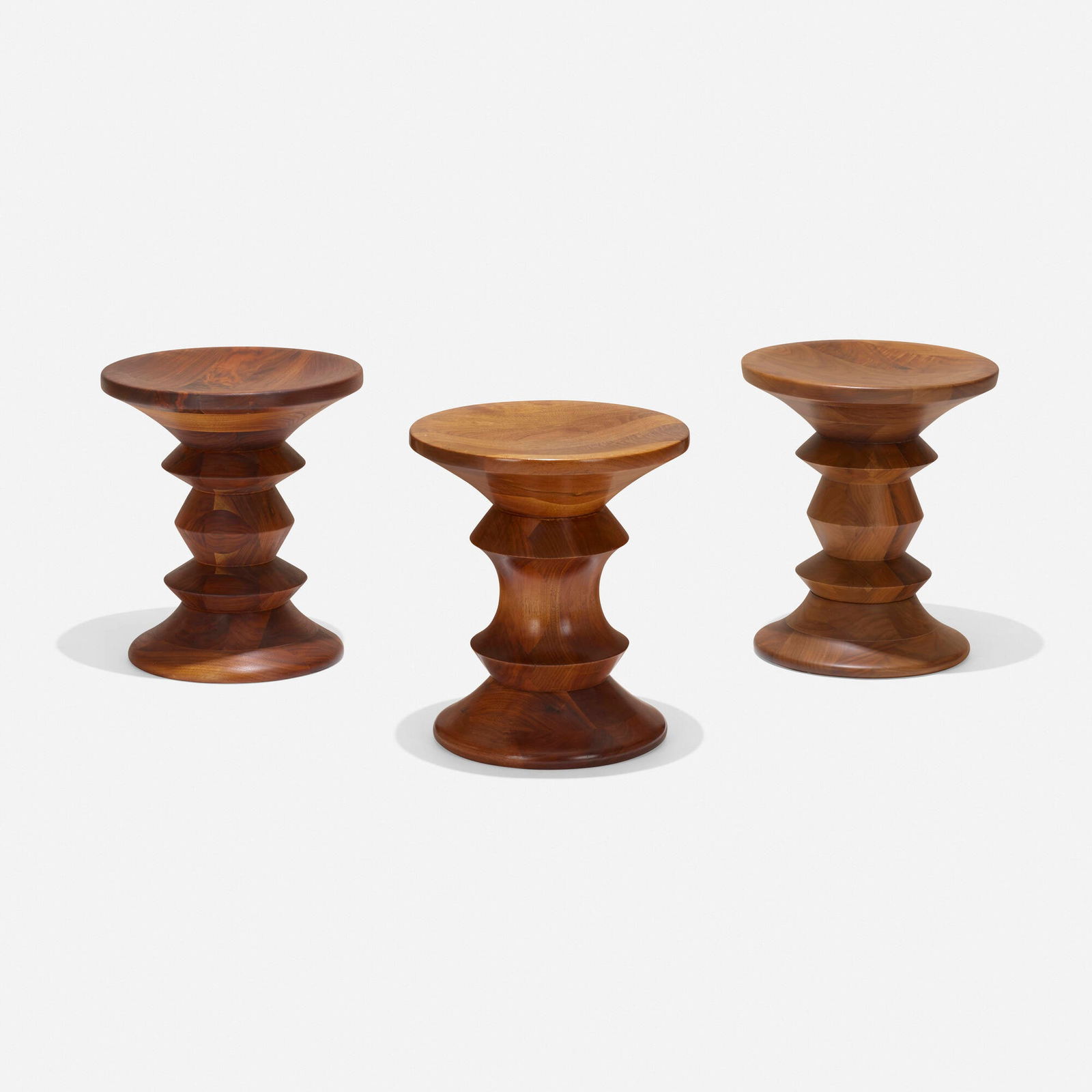 Eames, Time Life stools, set of three: Charles and Ray Eames Time Life stools, set of three Herman MillerUSA, 1960walnut 15 h x 13 dia in (38 x 33 cm) Literature: Eames Design: The Work of the Office of Ch