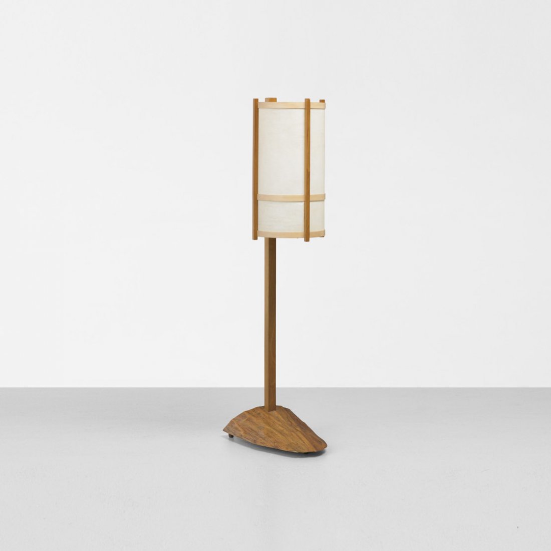 George Nakashima floor lamp: George Nakashima floor lamp USA, 1977 American black walnut, beech, parchment 14 w x 21 d x 57.75 h inches Solid wood base with natural surface. Signed with client name to underside of base: [Mach]. L