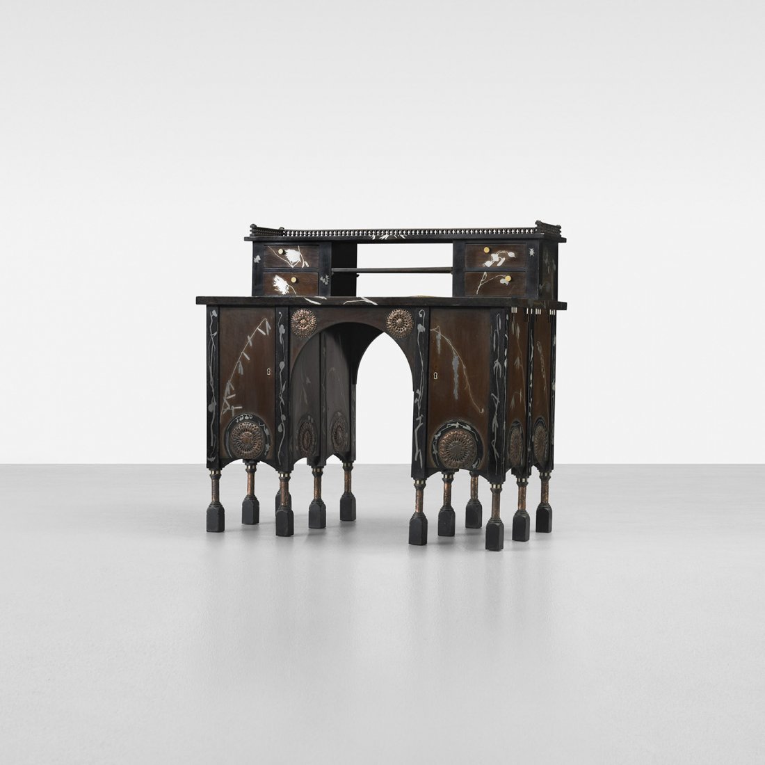 Carlo Bugatti desk: Carlo Bugatti desk Italy, c. 1905 ebonized wood with white metal inlay, lacquered wood, Italian walnut, vellum, copper, bone 43.5 w x 24 d x 41.25 h inches Desk features four small drawers and two doo