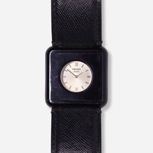 Prada, Watch: Prada Watch Italy Date: c. 1990 Movement: Quartz Case material: Plastic Case size: 45 mm Bracelet/Strap: Leather Clasp/Buckle: Pin buckle