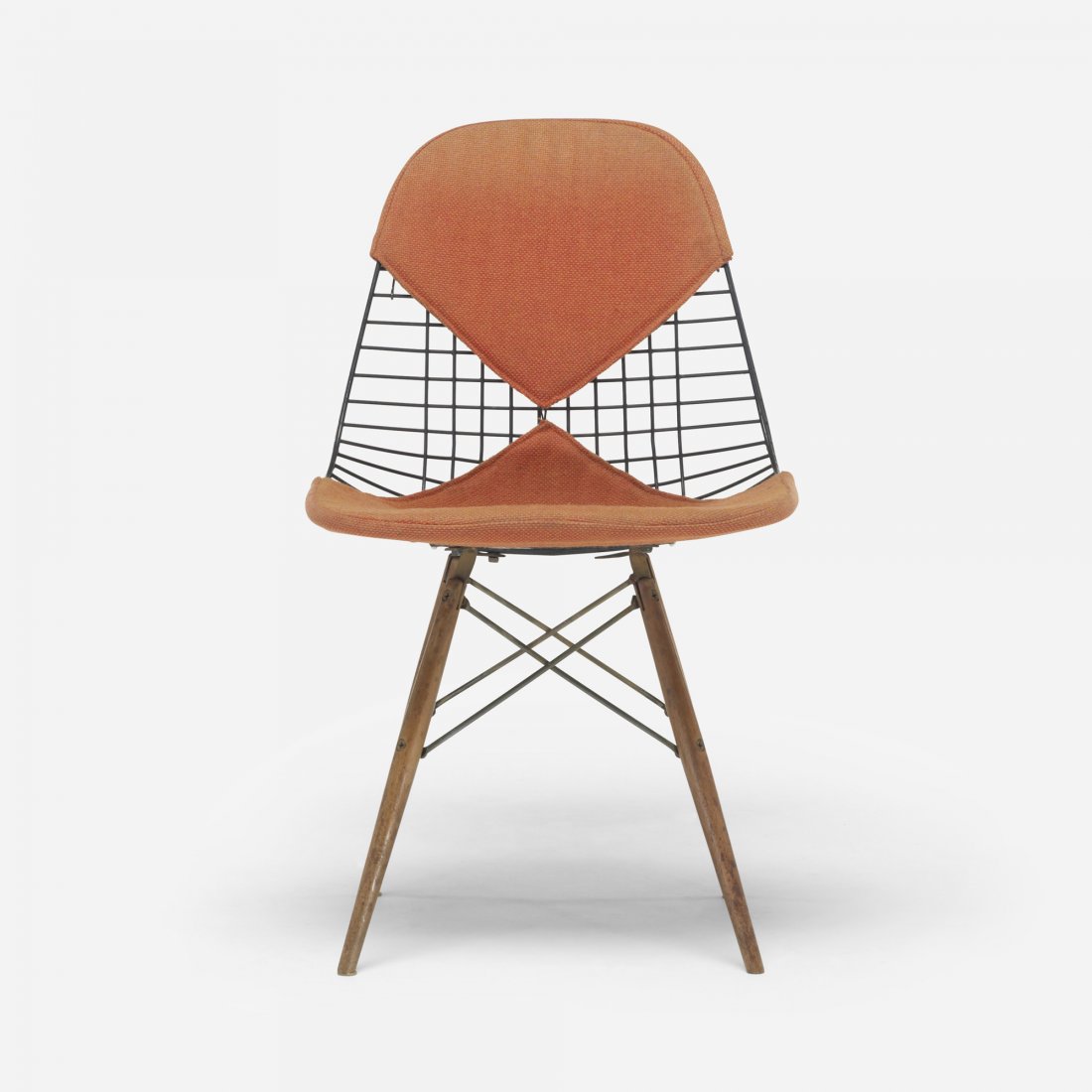 Charles and Ray Eames DKW: Charles and Ray Eames DKW Herman Miller USA, 1951 enameled steel, walnut, upholstery, plastic 19.25 w x 21 d x 32.5 h inches Signed with applied manufacturer's mark to underside: [Herman Miller Furnit