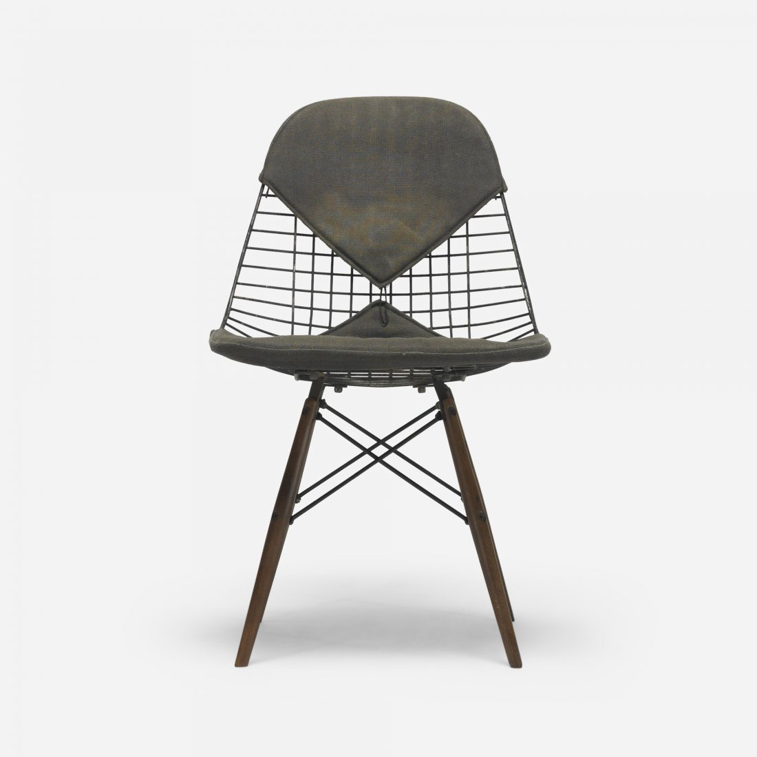 Charles and Ray Eames DKW: Charles and Ray Eames DKW Herman Miller USA, 1951 enameled steel, upholstery, walnut 19 w x 21 d x 31.5 h inches Signed with applied manufacturer's label to underside: [Made by Herman Miller Furniture