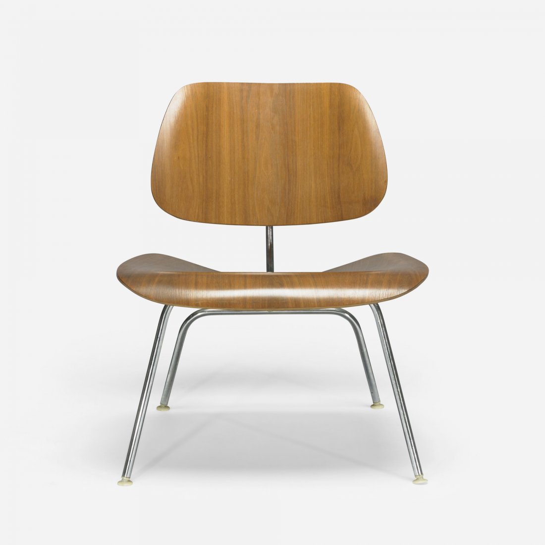 Charles and Ray Eames LCM: Charles and Ray Eames LCM Herman Miller USA, 1946/c. 1958 walnut plywood, chrome-plated steel, rubber, plastic 22 w x 26 d x 26.5 h inches Signed with applied disc manufacturer's label to underside: [