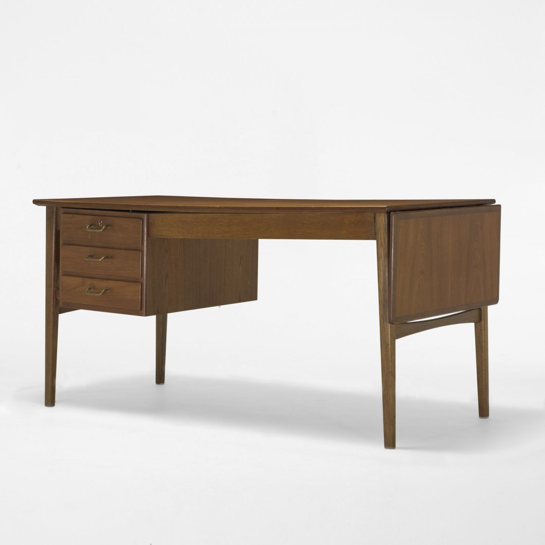 Ole Wanscher desk: Ole Wanscher desk A.J. Iversen Snedkermester Denmark, c. 1960 teak, brass 72.5 w x 29.5 d x 30 h inches Desk features three drawers and one 13.5-inch drop-leaf extension to one end; desk measures 59 i