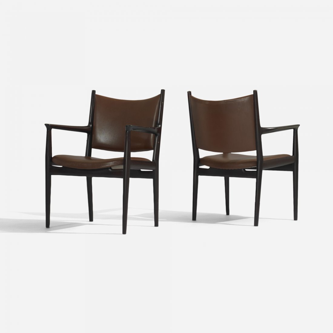 Hans Wegner armchairs, pair: Hans Wegner armchairs, pair Johannes Hansen Denmark, 1962 lacquered oak, leather 26.75 w x 24 d x 35.25 h inches Signed with applied metal manufacturer's label to underside of each example: [Design: H