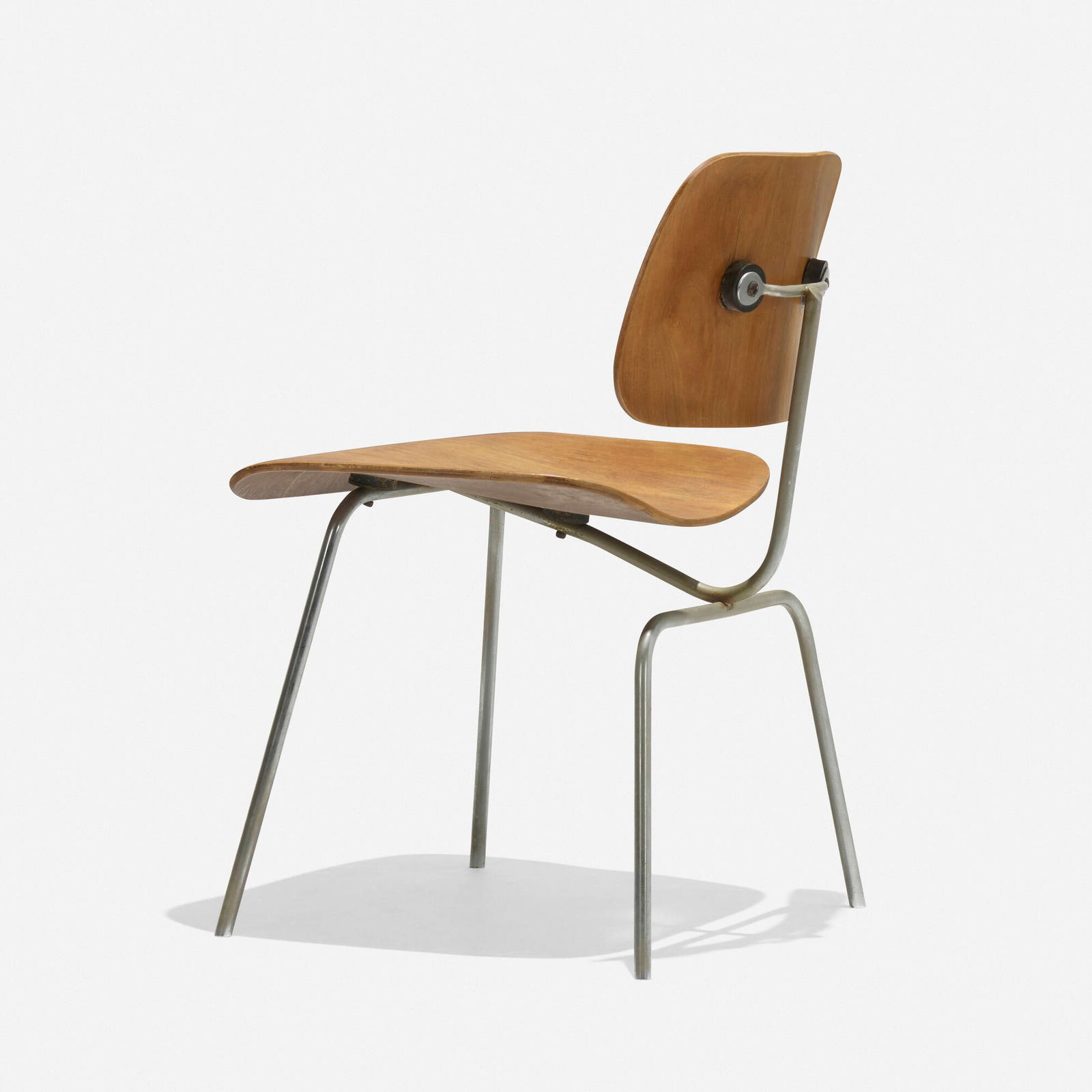 Charles and Ray Eames, DCM: Charles and Ray Eames DCM Evans Products/Herman MillerUSA, 1946 / c. 1948walnut plywood, chrome-plated steel, rubber 28.75 h x 19.25 w x 20.5 d in (73 x 49 x 52 cm) Foil decal manufactur