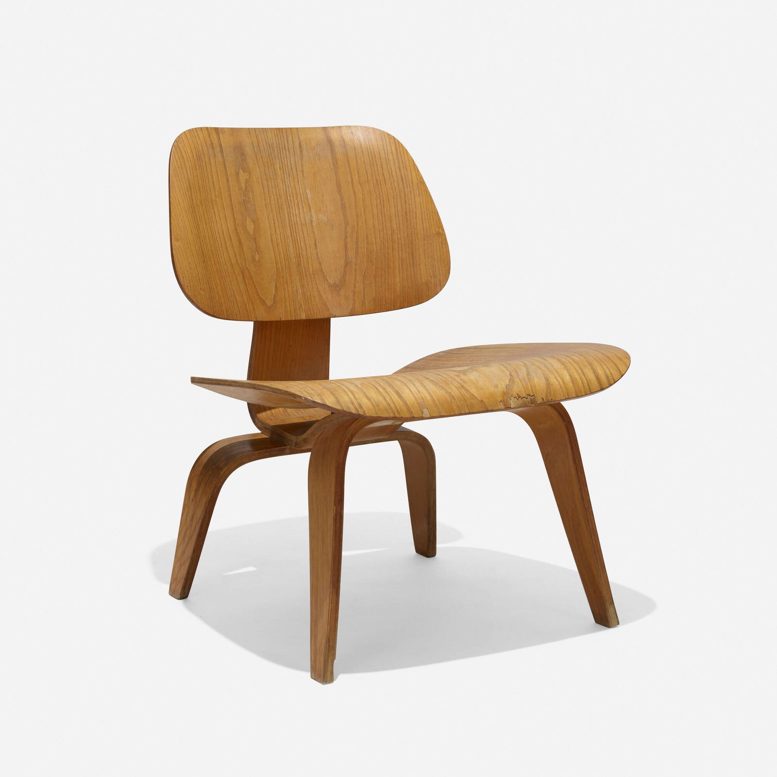 Charles and Ray Eames, LCW: Charles and Ray Eames LCW Evans Products/Herman MillerUSA, 1945 / c. 1948molded ash plywood, rubber 27 h x 22 w x 24 d in (69 x 56 x 61 cm) Decal manufacturer's label to underside 'Manuf