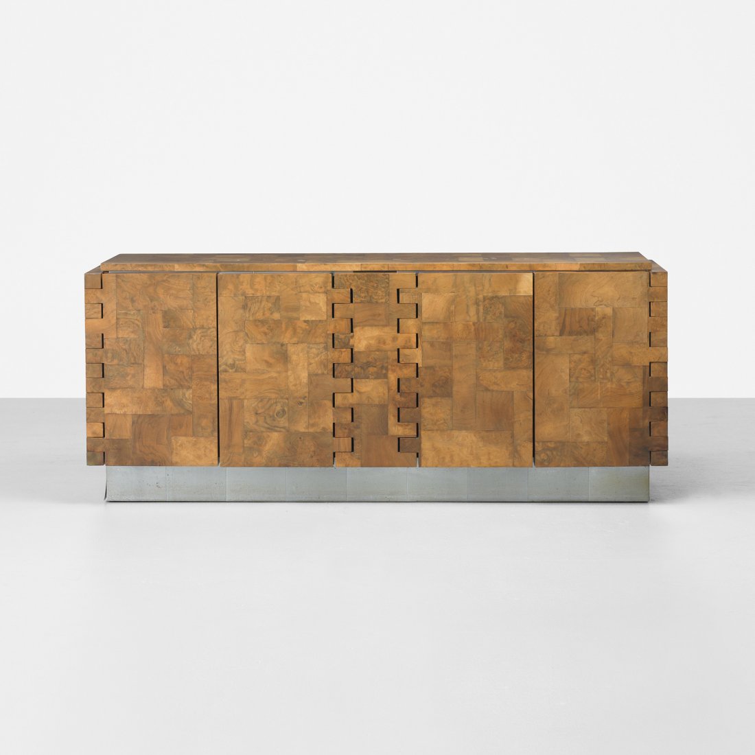 Paul Evans Cityscape cabinet: Paul Evans Cityscape cabinet Paul Evans Studio for Directional USA, c. 1970 walnut and maple burl, chrome-plated steel 76.5 w x 21.25 d x 32 h inches Cabinet features four doors concealing two adjusta