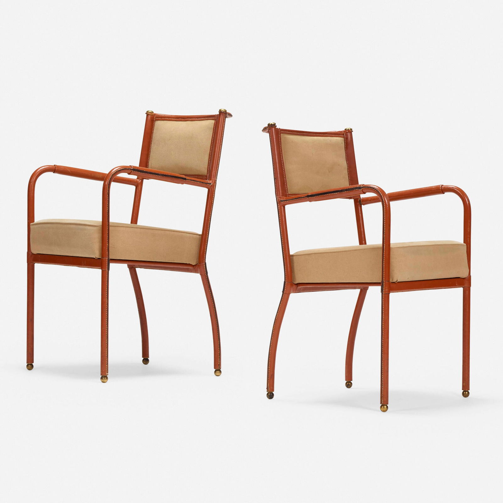 In the manner of Jacques Adnet, Armchairs, pair (1 of 5)