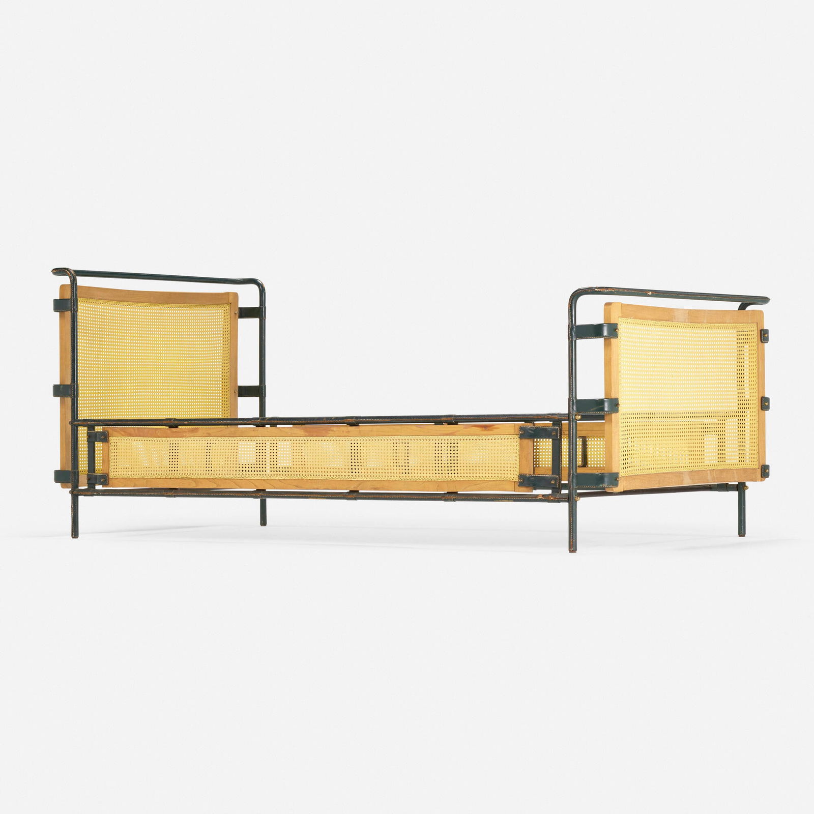 Jacques Adnet, attribution, Daybed: Jacques Adnet, attribution Daybed France, c. 1955saddle-stitched leather over steel, beech, brass, plastic cane 35.75 h x 40.5 w x 87.5 d in (91 x 103 x 222 cm) This work will shi