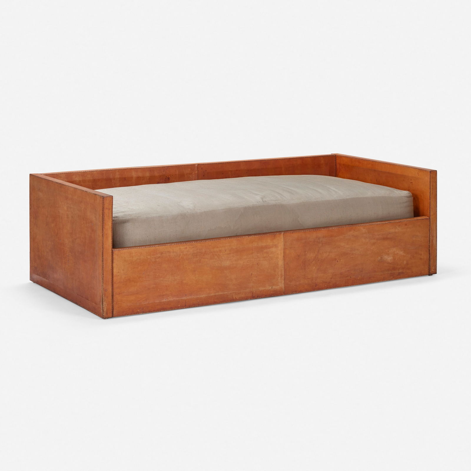 In the manner of Jacques Adnet, Daybed: In the manner of Jacques Adnet Daybed c. 1955leather over wood, upholstery 24.25 h x 83.25 w x 39.5 d in (62 x 211 x 100 cm) This work will ship from Los Angeles, California.