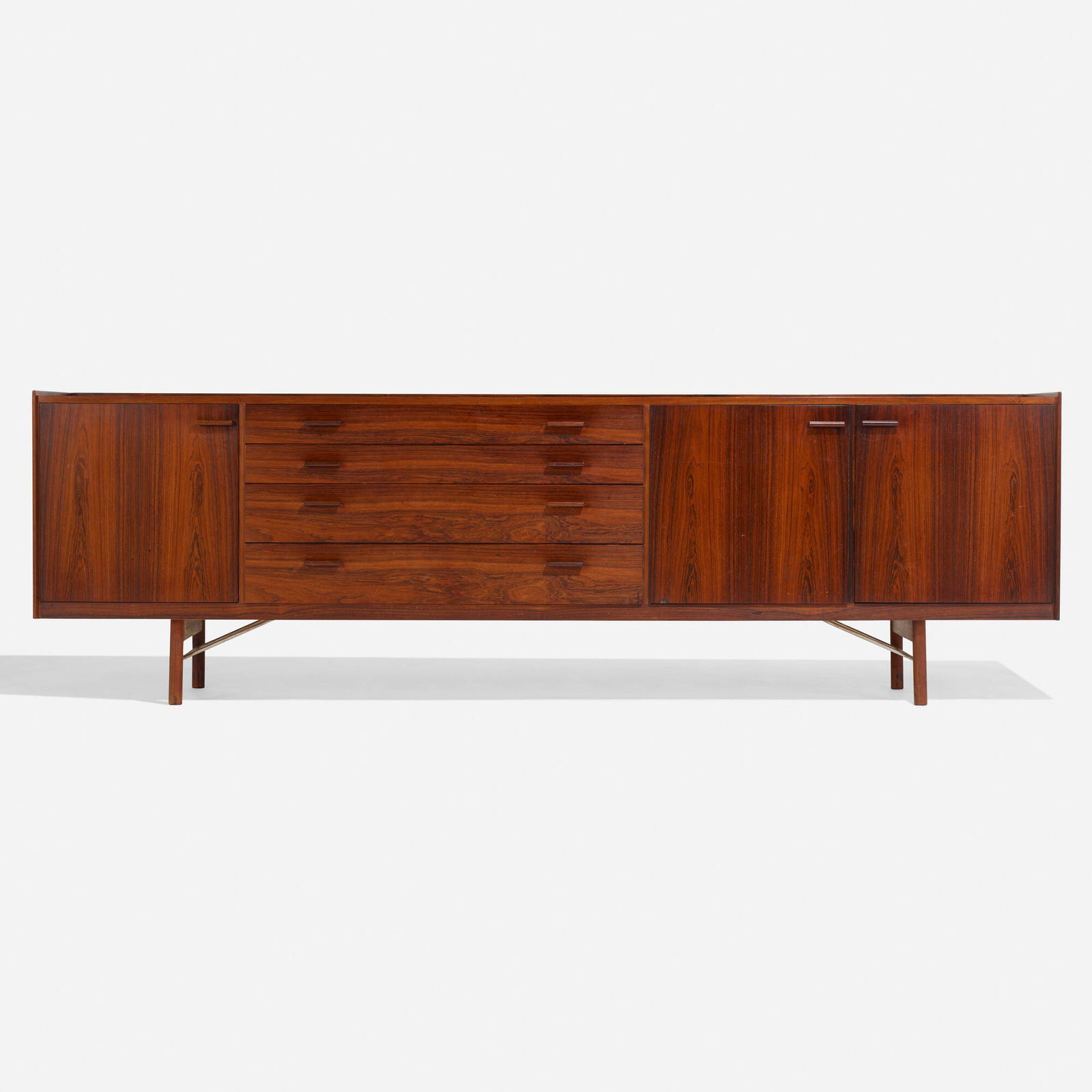 Ib Kofod-Larsen, Cabinet: Ib Kofod-Larsen Cabinet Brande MobelfabrikDenmark, c. 1960rosewood, steel 31.375 h x 102 w x 20.25 d in (80 x 259 x 51 cm) Cabinet features four drawers, one door concealing one shelf, a