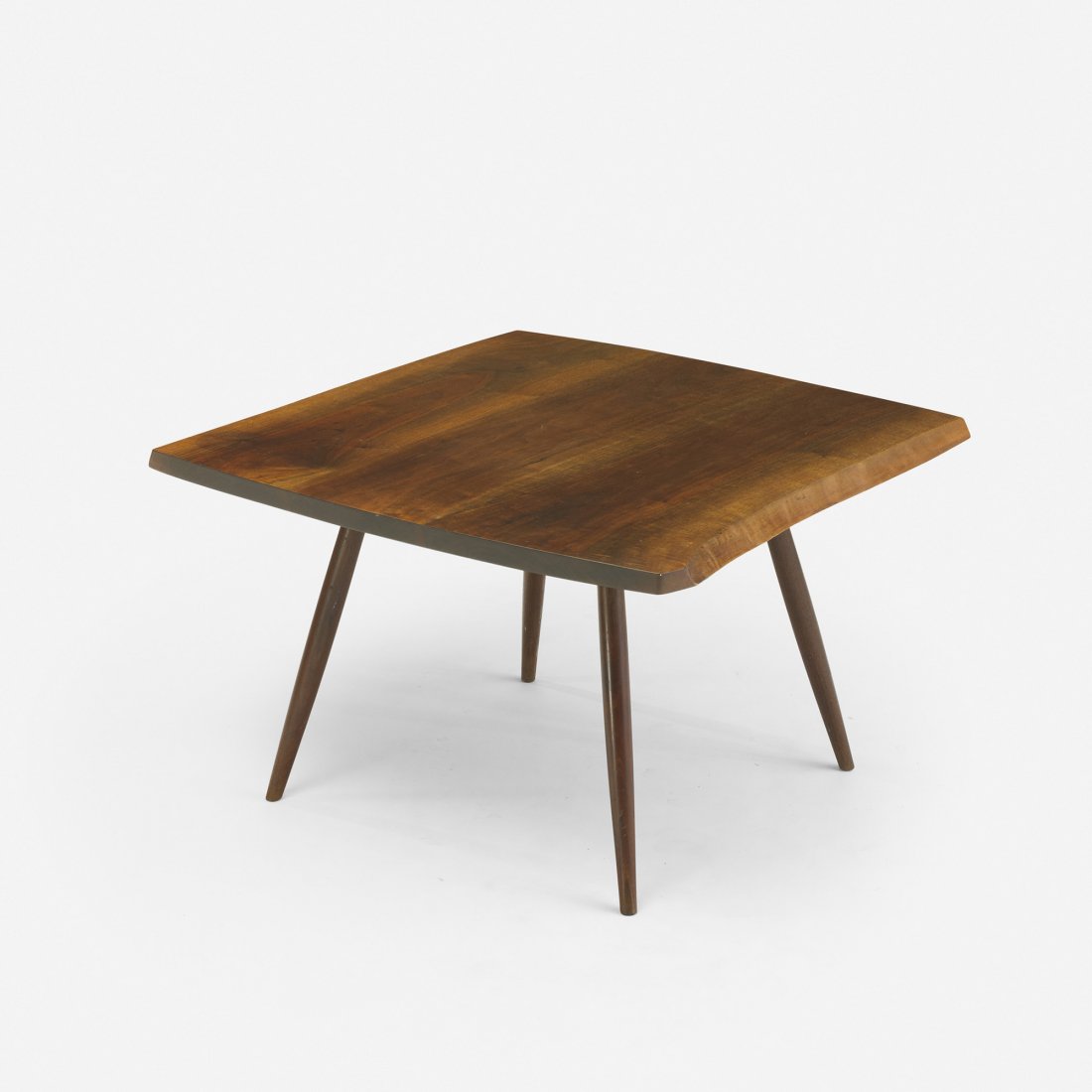 George Nakashima coffee table: George Nakashima coffee table USA, c. 1960 American black walnut 32.5 w x 32 d x 20 h inches Joined top features two free edges and sap-grain details. Signed with client's name to underside: [Natten].