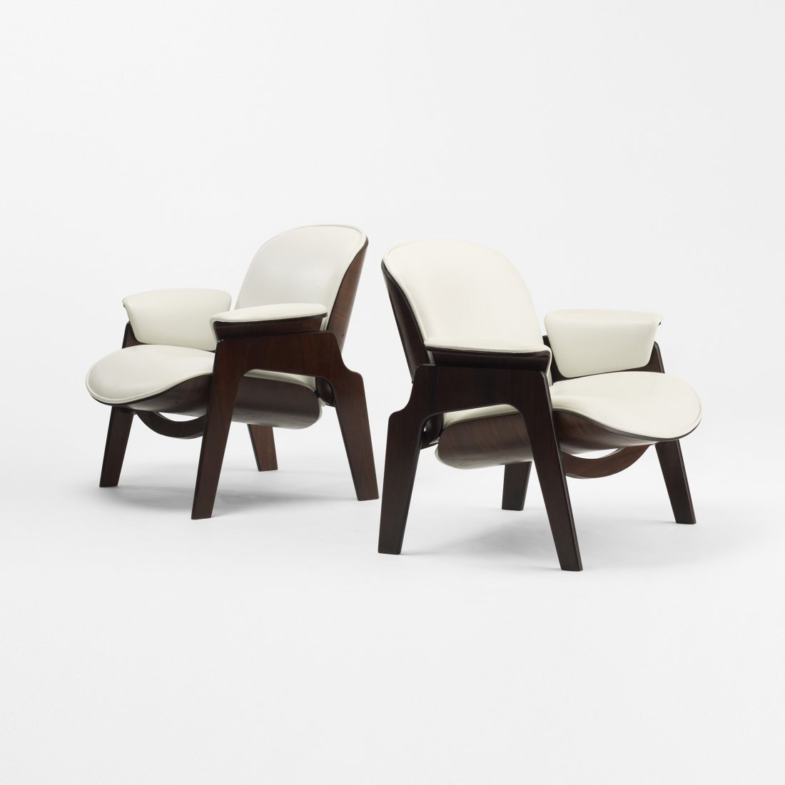 Ico Parisi lounge chairs, pair: Ico Parisi lounge chairs, pair MIM Italy, c. 1955 rosewood, vinyl 33 w x 31.5 d x 30 h inches Signed with applied disc manufacturer's label to underside of each example: [MIM Roma]. Literature: Rivist