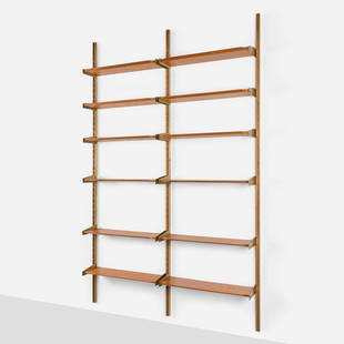 Pierluigi Spadolini, attribution, Wall-mounted shelving unit: Pierluigi Spadolini, attribution Wall-mounted shelving unit Italy, c. 1956Italian walnut, brass 114.875 h x 72.875 w x 10.5 d in (292 x 185 x 27 cm) Shelving unit is comprised of three upright