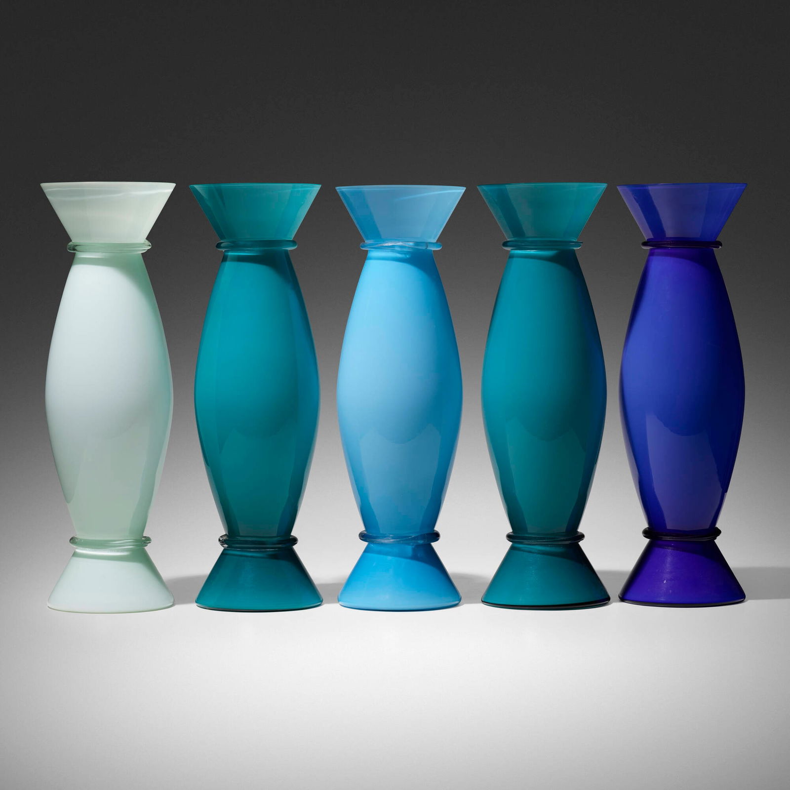 Alessandro Mendini, Acco vases, set of five: Alessandro Mendini Acco vases, set of five VeniniItaly, 2001-2002incamiciato glass 17.5 h x 5 w in (44 x 13 cm) 17.25 h x 5.25 w in (44 x 13 cm) Etched signature and date to underside