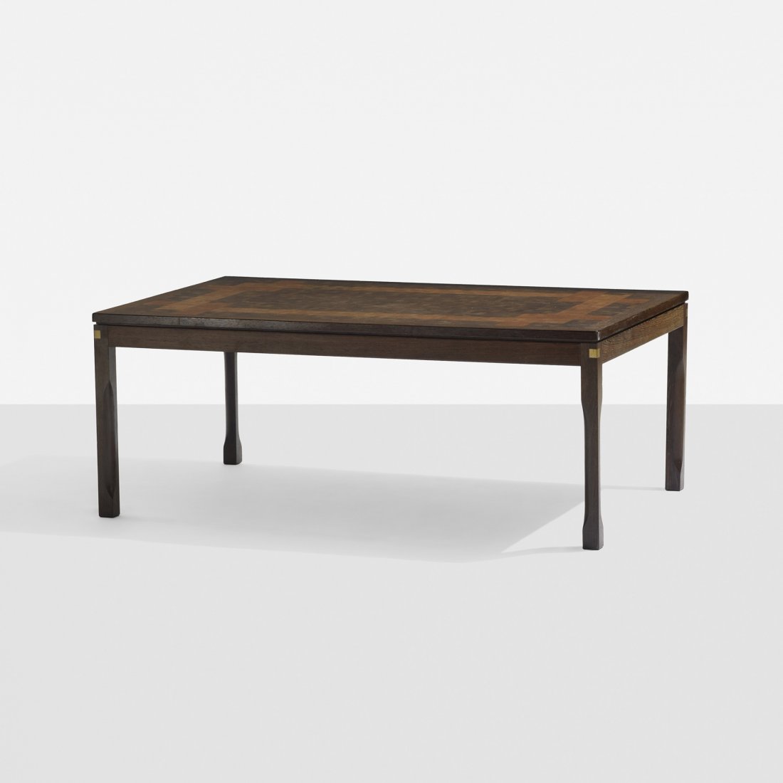 Rolf Middelboe and Gorm Lindum coffee table: Rolf Middelboe and Gorm Lindum coffee table Tranekær Furniture Denmark, c. 1974 wenge, fruitwood, brass 52 w x 31.5 d x 20.5 h inches Signed with applied brass manufacturer's label to leg: [Tranekær