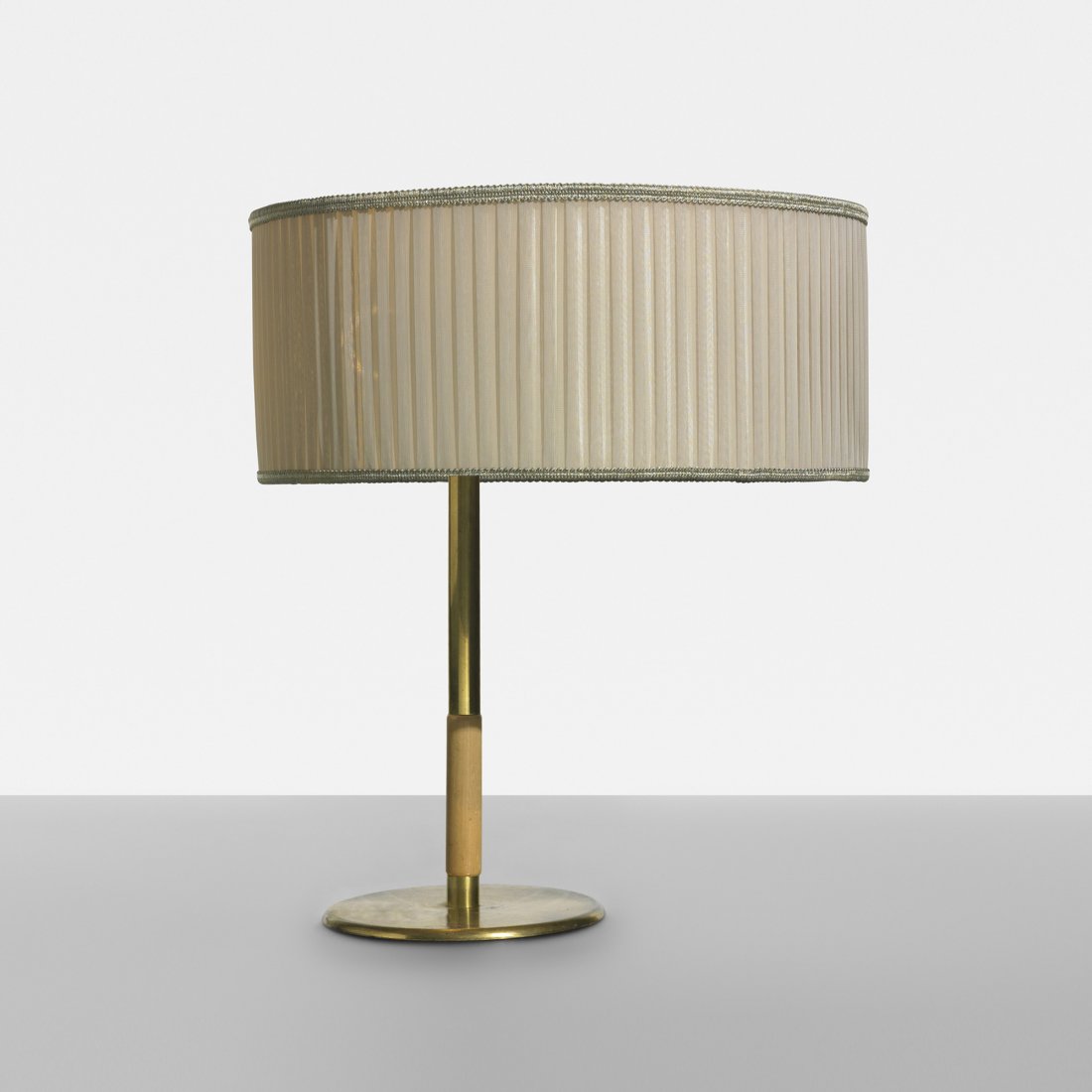 Paavo Tynell table lamp: Paavo Tynell table lamp Taito OY Finland, c. 1940 brass, brass-plated steel, birch, enameled steel, silk 16 dia x 18.25 h inches Signed with cast manufacturer's mark to underside: [Taito].