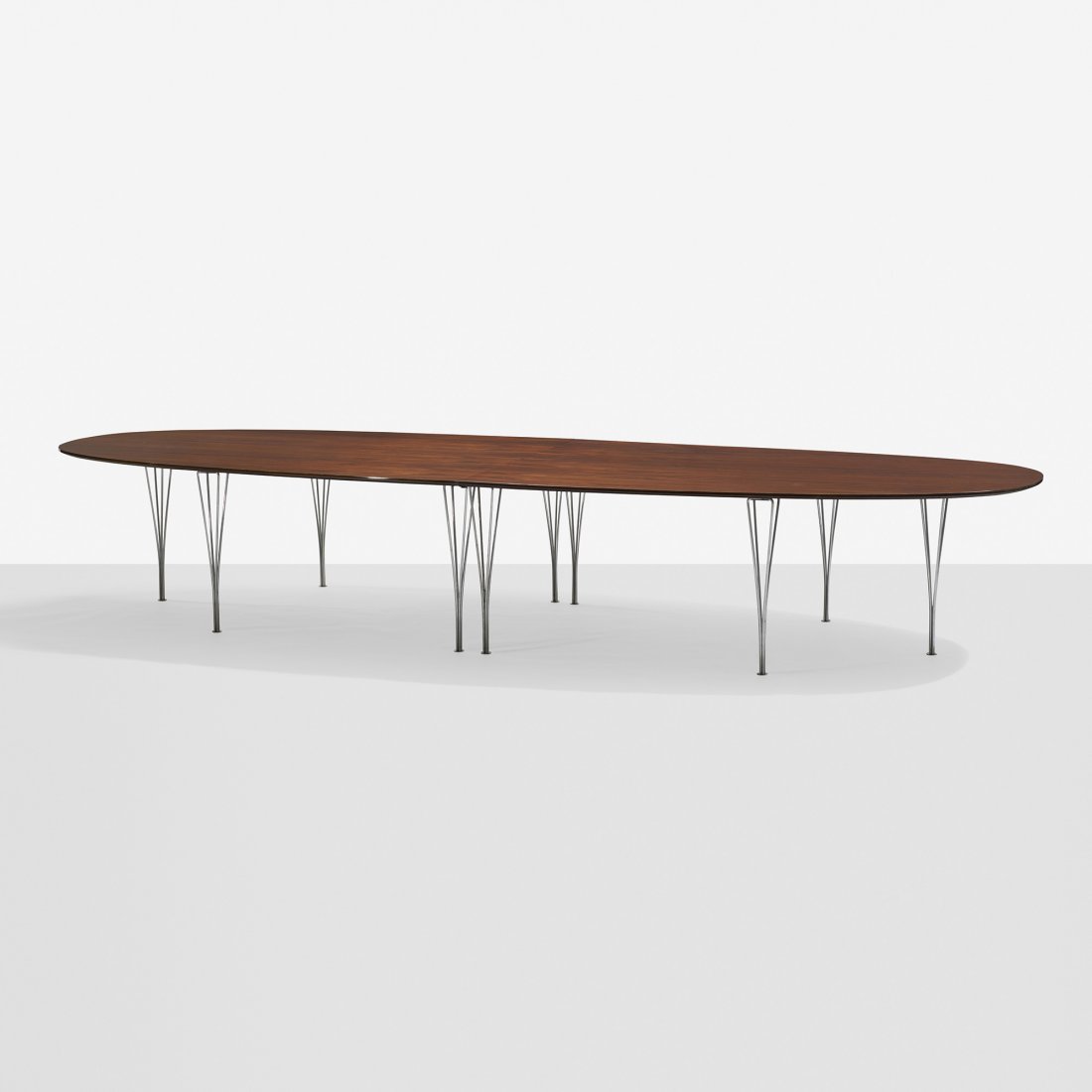 Jacobsen, Hein and Mathsson Super Ellipse table: Arne Jacobsen, Piet Hein and Bruno Mathsson Super Ellipse table Fritz Hansen Denmark/Sweden, 1968/1975 rosewood, chrome-plated steel 165.5 w x 55.25 d x 27.5 h inches Signed with decal manufacturer's